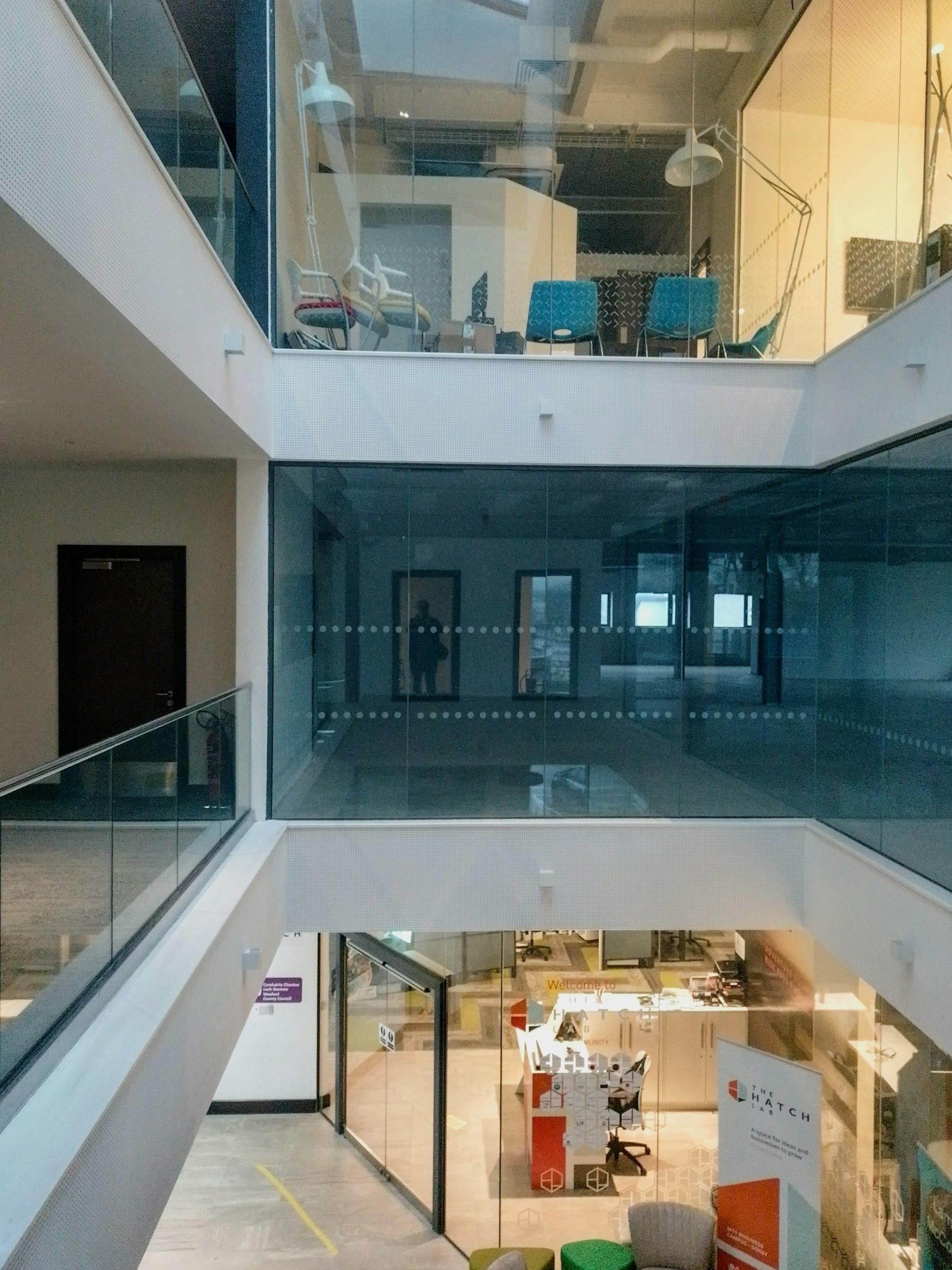 Light passing through the structured levels of a contemporary office atrium